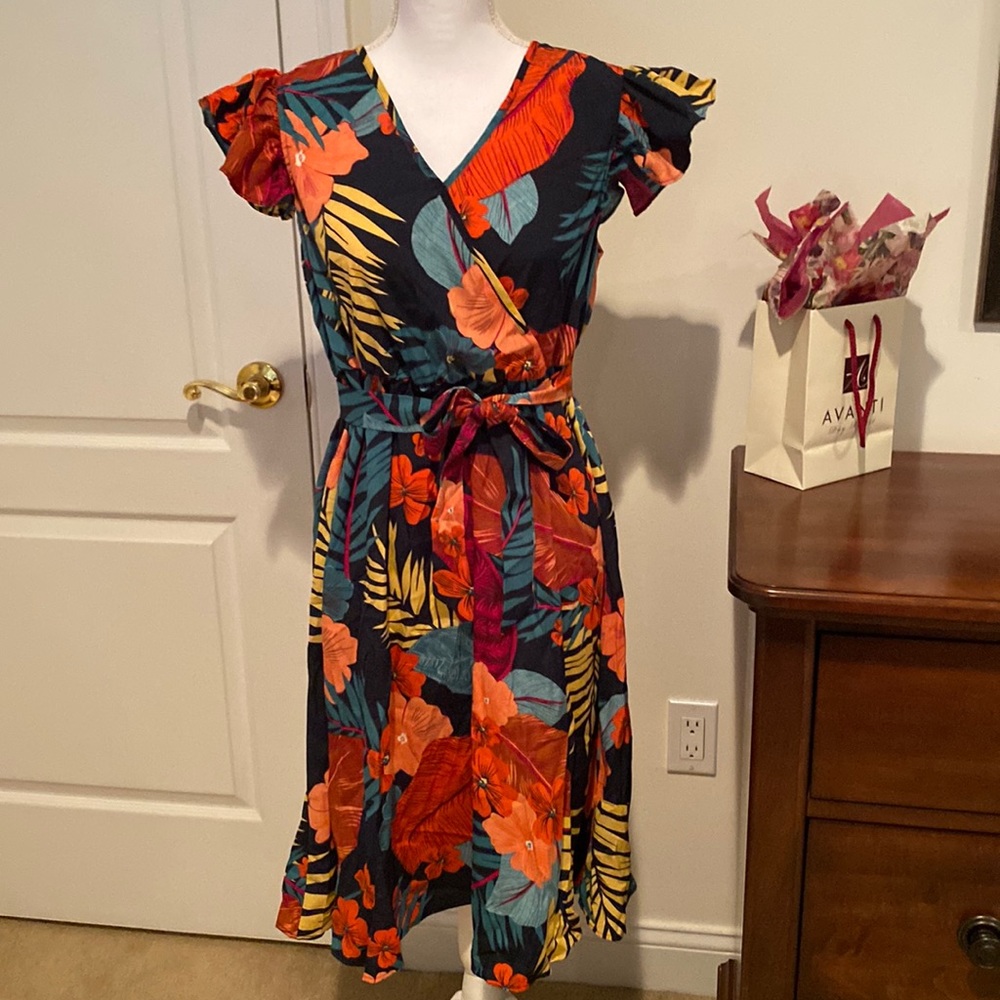 New with tags. Dress with black base and floral design